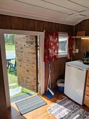an open door to a kitchen in a tiny house at Bjørgebu Camping AS in Mysusæter