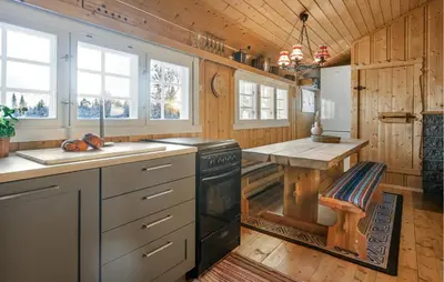 a kitchen with a stove and a counter top at 3 Bedroom Amazing Home In Gol in Gol