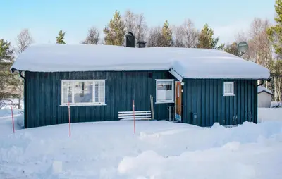 a green house with snow on top of it at Gorgeous Home In Os I Østerdalen in Os