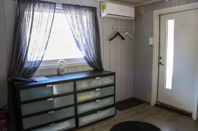 a bedroom with a dresser with a window and a dresser at Hus nær lillehammer og sjusjøen in Lillehammer