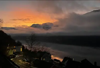 a view of a sunset with clouds in the sky at Fjordview 35 in Lofthus