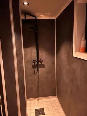 a shower stall in a bathroom with a shower at Stabbur med fantastisk utsikt! in Steinkjer