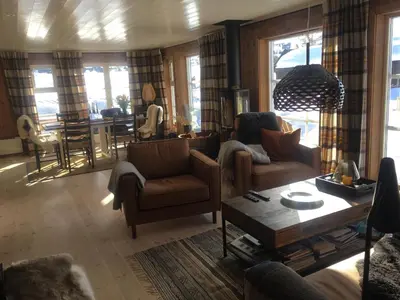 a living room with two chairs and a table at New and cozy family cabin on Golsfjellet in Golsfjellet