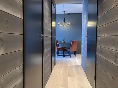 a hallway with a dining room with a table at Riddergaardens panorama in Beitostøl