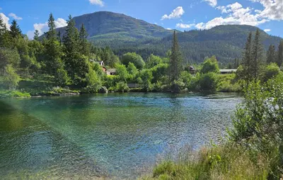 a river with trees and mountains in the background at 3 Bedroom Nice Apartment In Hemsedal in Hemsedal