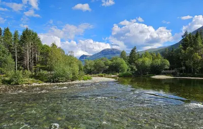 a river with trees and mountains in the background at 2 Bedroom Cozy Apartment In Hemsedal in Hemsedal