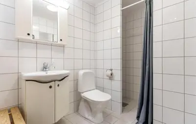 a white bathroom with a toilet and a sink at Pet Friendly Apartment In Hemsedal in Hemsedal