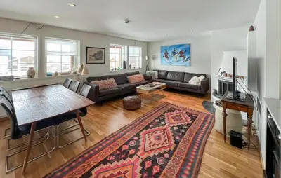a living room with a couch and a table at 3 Bedroom Cozy Apartment In Gålå in Frya