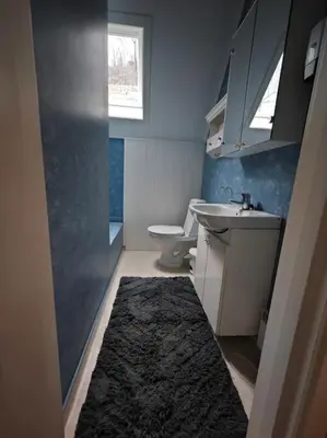 a small bathroom with a sink and a toilet at Rekkehus Tyssedal Trolltunga in Tveit