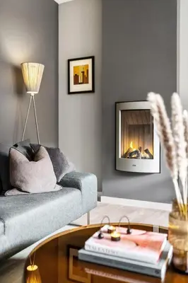 a living room with a couch and a fireplace at Modern Apartment In The Heart of Bergen in Bergen