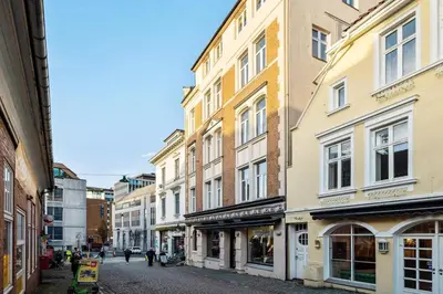 a group of buildings on a city street at Modern Apartment In The Heart of Bergen in Bergen