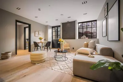 a living room with a couch and a table at Stay l Luxurious Hideaway in Centrum in Bergen