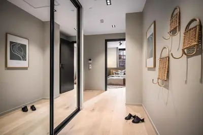 a room with a hallway with shoes on the floor at Stay l Luxurious Hideaway in Centrum in Bergen