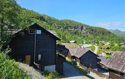a group of houses on a hill with a mountain at Awesome Apartment In Hemsedal With Wifi in Hemsedal