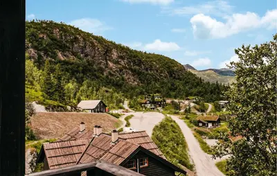 a winding road through a village in the mountains at Awesome Apartment In Hemsedal With Wifi in Hemsedal
