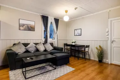 a living room with a couch and a table at Central stay apartment - 302 in Bergen