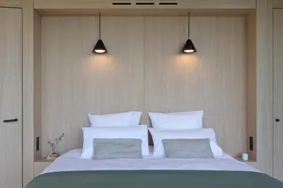 a bedroom with a large bed with two pillows at Sogndal Fjordpanorama- The Panorama View 2 in Sogndal