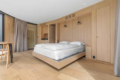 a bedroom with a large white bed in it at Sogndal Fjordpanorama- The Panorama View 2 in Sogndal