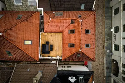 an overhead view of a group of red brick buildings at Central stay apartment - 303 in Bergen