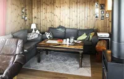 a living room with a couch and a coffee table at Stunning Home In Lensvik With Wifi in Lensvik