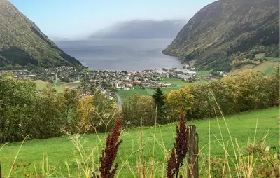 a view of a town in a valley with mountains at 3 Bedroom Beautiful Home In Vik I Sogn in Stadheim