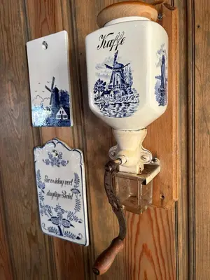 a toilet on a wall with pictures of a ship at Eventyrtunet in idyllic Tuddal in Hjartdal