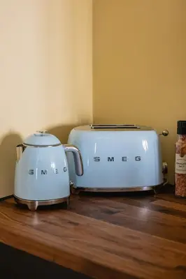 two toasters sitting on top of a wooden counter at Dinbnb Homes I Bergen's #1 BNB I Jacuzzi & Fireplace & Balcony in Bergen