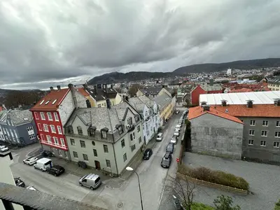 an aerial view of a city with buildings and cars at Sjarmerende bolig like ved togstasjonen in Bergen