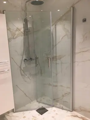 a shower with a glass door in a bathroom at Villa Skoglund in Stranda