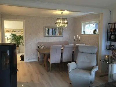 a dining room with a table and chairs at Villa Skoglund in Stranda