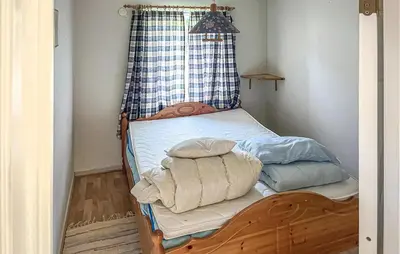 a bedroom with a bunk bed with a window at Gorgeous Apartment In Eresfjord in Nauste