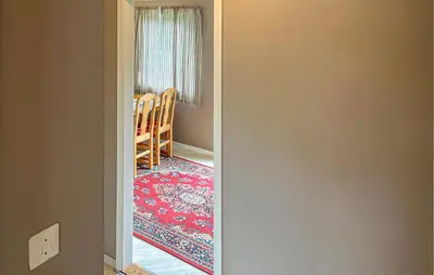 a view of a room with a table and chairs at Gorgeous Apartment In Eresfjord in Nauste