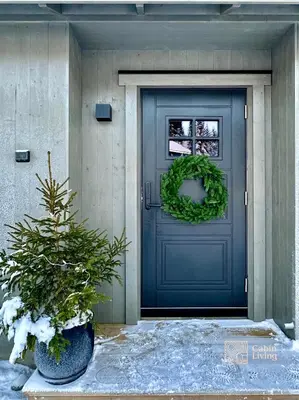 a blue front door with a wreath on it at New cabin at Skeikampen, perfect for families! in Svingvoll
