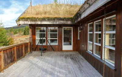a porch of a house with a grass roof at Gorgeous Home In Venabygd With Sauna in Venabygd