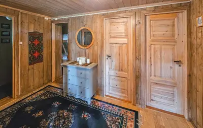 a room with a door and a table and a rug at Beautiful Home In Gol With Kitchen in Gol