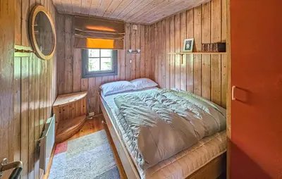 a bedroom with a bed in a wooden cabin at Beautiful Home In Gol With Kitchen in Gol