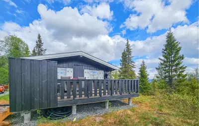a tiny house on a bench in a field at Beautiful Home In Gol With Kitchen in Gol