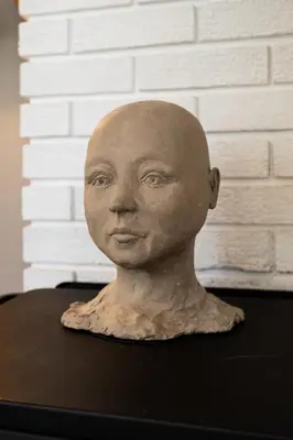 a bust of a bald man sitting on a table at Sunny apartment in Ålesund city in Ålesund