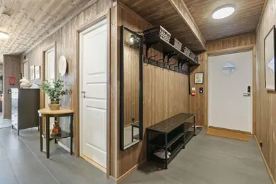 a hallway with a dressing room with a dressing table at Cozy Apartment close to Hovden alpine centre in Hovden
