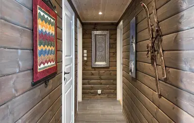 a hallway in a house with wooden walls at 4 Bedroom Awesome Home In Vøringsfoss in Garden