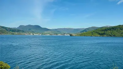 a large body of water with mountains in the background at Magnar in Etnesjøen