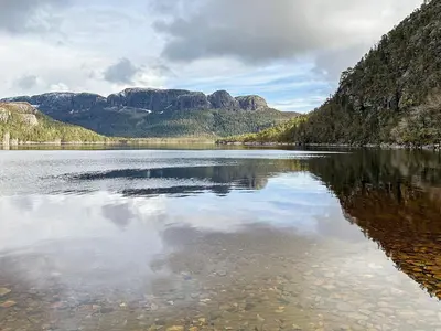 a large body of water with mountains in the background at 4 person holiday home in Lysøysundet in Teksdal