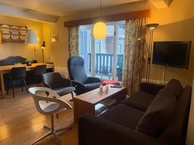 a living room with a couch and chairs and a table at Cozy Ground-Floor Apartment In Beitostølen in Beitostøl