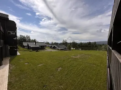 an aerial view of a large yard with buildings at Ideal Base For Exploring 2 Bedrooms & Balcony in Beitostøl