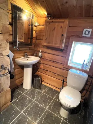 a bathroom with a toilet and a sink at Geilo centrum - cozy apartment - central location in Geilo