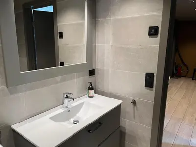 a bathroom with a sink and a mirror at Riddertunets utsikt til Slettefjell in Beitostøl