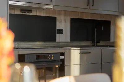 a kitchen with an oven and a sink and a counter at Stryn Wiew Logde Tverrfjellet in Stryn