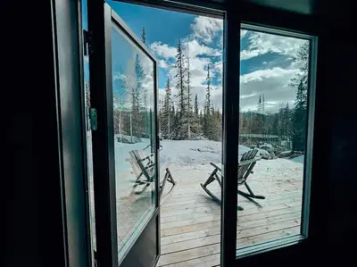 a view from a window of a deck with a bench at Cozy Mountain Cottage with beautiful views & Sauna in Beitostøl