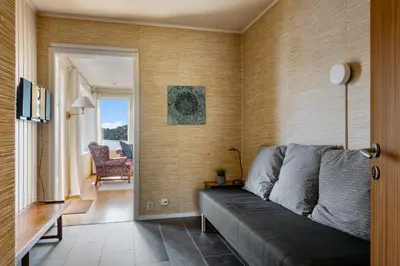 a living room with a couch and a chair at Villa Ocean View in Askøy