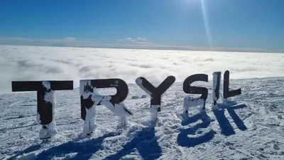 a sign in the snow on top of a mountain at Alpinvegen 22B, Trysil Alpin 22B in Trysil